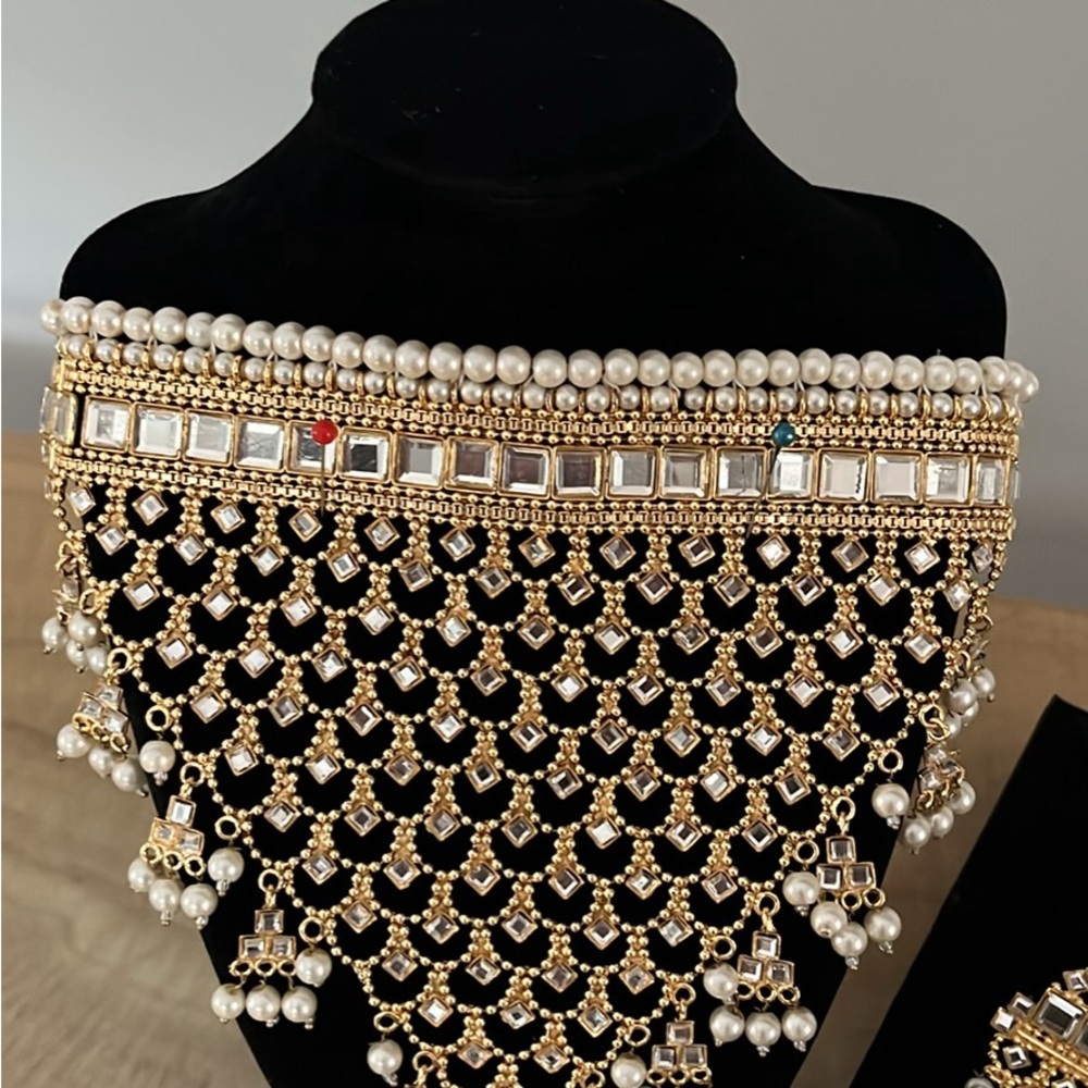 Beautiful kundun and pearls set. Ear rings and tikka ( forehead ornament )